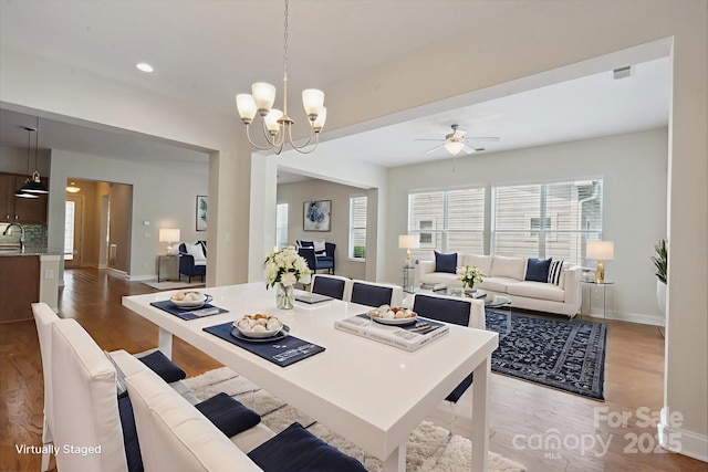 467 Granite Lake Ct, Denver, NC 28037 - dining room featuring wood finished floors, baseboards, a ceiling fan, a chandelier, and recessed lighting