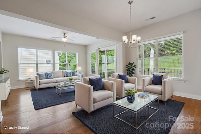 467 Granite Lake Ct, Denver, NC 28037 - living area featuring plenty of natural light, baseboards, a chandelier, and wood finished floors
