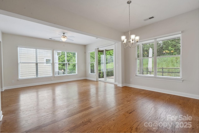 467 Granite Lake Ct, Denver, NC 28037 - unfurnished room featuring wood finished floors, baseboards, a chandelier, and a ceiling fan