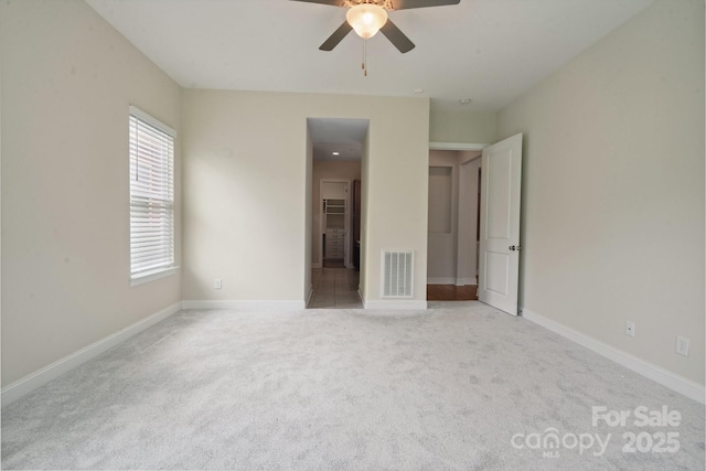 467 Granite Lake Ct, Denver, NC 28037 - unfurnished bedroom with light colored carpet, multiple windows, and baseboards