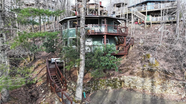 109 Beechwood Ln, Beech Mountain, NC 28604 - back of house featuring stairs, a wooden deck, and a sunroom