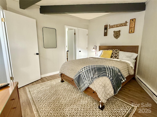 109 Beechwood Ln, Beech Mountain, NC 28604 - bedroom featuring baseboard heating, wood finished floors, beam ceiling, and baseboards