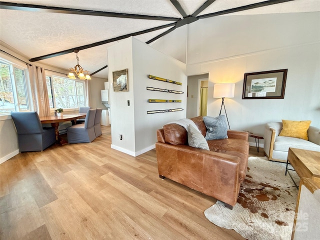 109 Beechwood Ln, Beech Mountain, NC 28604 - living area featuring light wood-style flooring, a chandelier, baseboards, and a textured ceiling