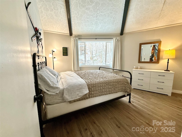 109 Beechwood Ln, Beech Mountain, NC 28604 - bedroom with wood finished floors, baseboards, and high vaulted ceiling