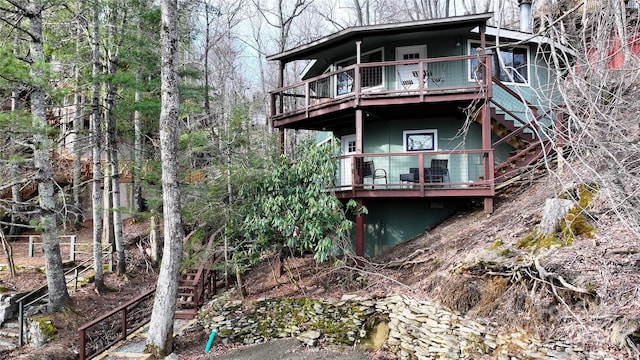 109 Beechwood Ln, Beech Mountain, NC 28604 - rear view of house with stairway and a wooden deck