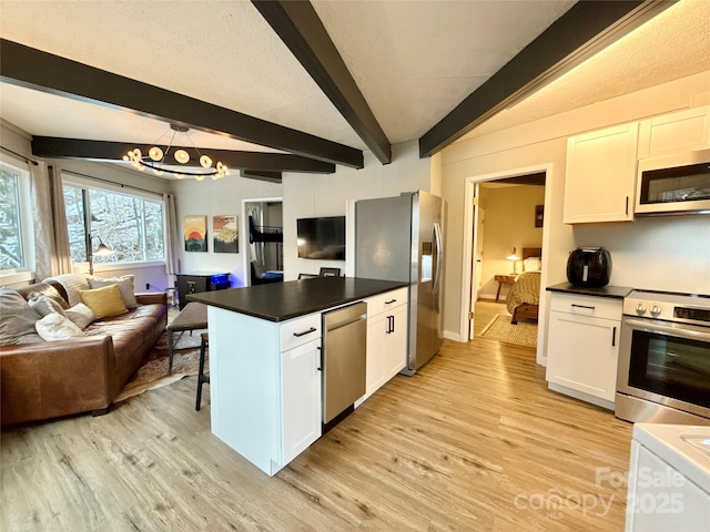 109 Beechwood Ln, Beech Mountain, NC 28604 - kitchen featuring stainless steel appliances, open floor plan, beamed ceiling, light wood finished floors, and a chandelier