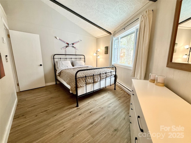 109 Beechwood Ln, Beech Mountain, NC 28604 - bedroom with a baseboard radiator, light wood-style floors, vaulted ceiling, and a textured ceiling
