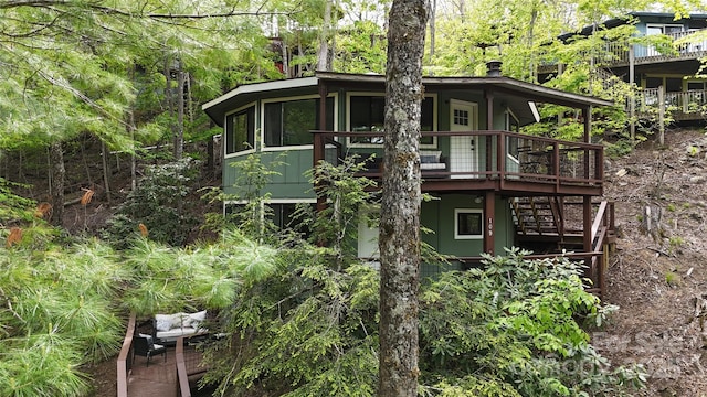109 Beechwood Ln, Beech Mountain, NC 28604 - rear view of house with a wooden deck and stairs