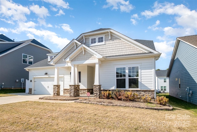 3105 Bonterra Blvd, Indian Trail, NC 28079 - craftsman-style house featuring stone siding, covered porch, driveway, a garage, and a front lawn