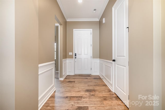 3105 Bonterra Blvd, Indian Trail, NC 28079 - hallway featuring crown molding, light wood finished floors, and wainscoting
