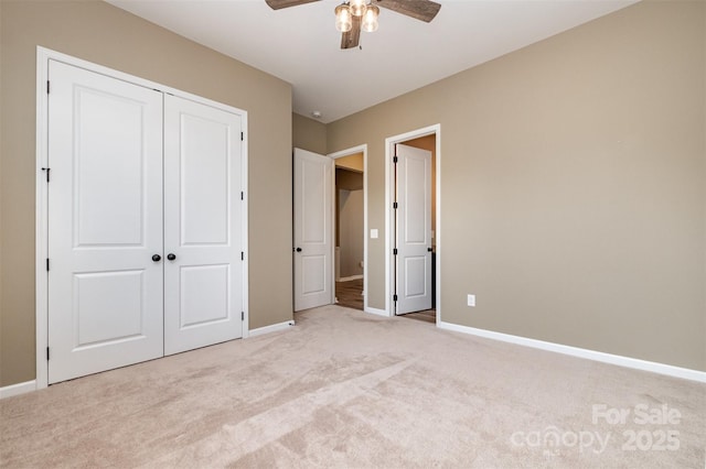 3105 Bonterra Blvd, Indian Trail, NC 28079 - unfurnished bedroom featuring light colored carpet, baseboards, a closet, and a ceiling fan