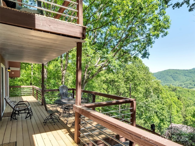 80 Hidden Falls Rd, Maggie Valley, NC 28751 - wooden terrace featuring outdoor dining area, a mountain view, and a wooded view