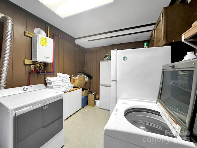 80 Hidden Falls Rd, Maggie Valley, NC 28751 - kitchen featuring freestanding refrigerator, washing machine and clothes dryer, water heater, and wood walls