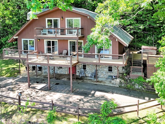 80 Hidden Falls Rd, Maggie Valley, NC 28751 - rear view of house with a balcony, a patio area, stairs, a wooden deck, and stone siding