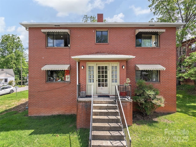 19 Murdock Ave Unit 1, 2, 3, 4, Asheville, NC 28804 - multi unit property featuring a front yard, brick siding, and a chimney