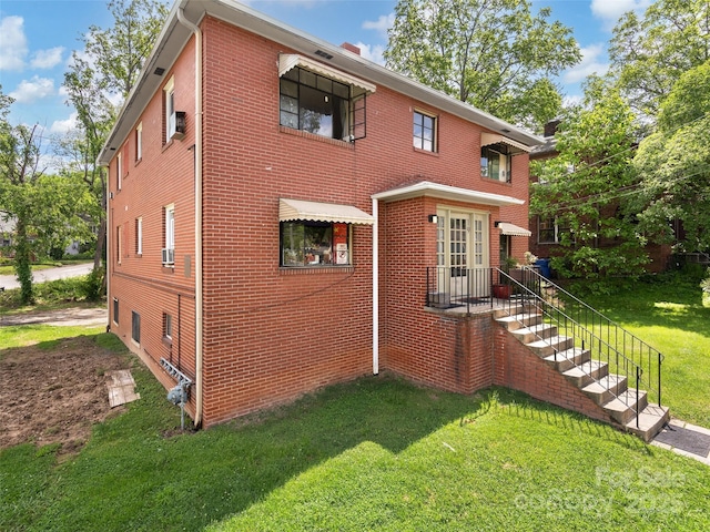 19 Murdock Ave Unit 1, 2, 3, 4, Asheville, NC 28804 - view of property exterior featuring a yard, brick siding, and a chimney