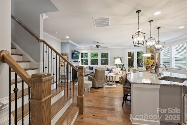528 Sandbar Pt, Clover, SC 29710 - kitchen featuring a sink, a ceiling fan, crown molding, recessed lighting, and hanging light fixtures