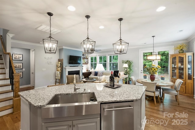 528 Sandbar Pt, Clover, SC 29710 - kitchen with a sink, open floor plan, crown molding, light wood-style floors, and a chandelier
