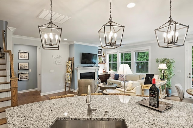528 Sandbar Pt, Clover, SC 29710 - kitchen featuring a chandelier, a sink, wood finished floors, crown molding, and recessed lighting