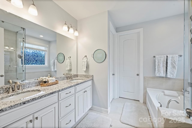 528 Sandbar Pt, Clover, SC 29710 - bathroom featuring a bath, tile patterned floors, double vanity, a shower stall, and baseboards