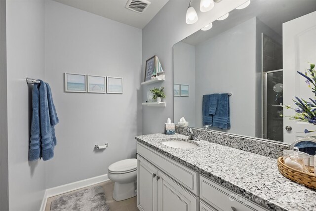 528 Sandbar Pt, Clover, SC 29710 - bathroom with a stall shower, vanity, toilet, and baseboards