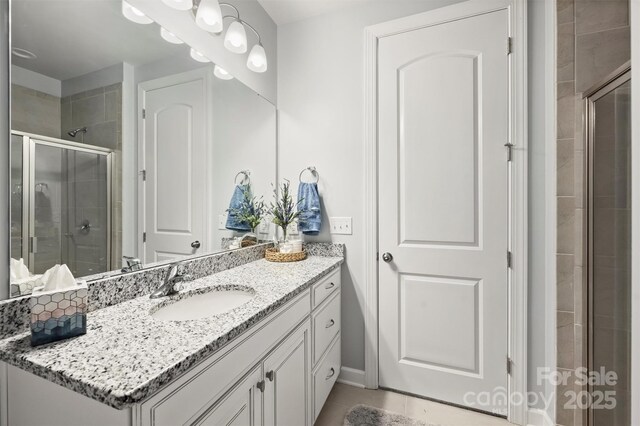 528 Sandbar Pt, Clover, SC 29710 - bathroom with a stall shower, vanity, and tile patterned floors
