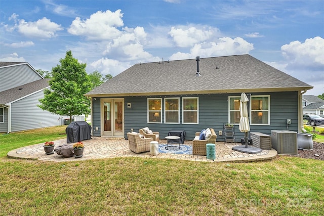 528 Sandbar Pt, Clover, SC 29710 - back of property with central AC unit, a patio area, a yard, and a shingled roof