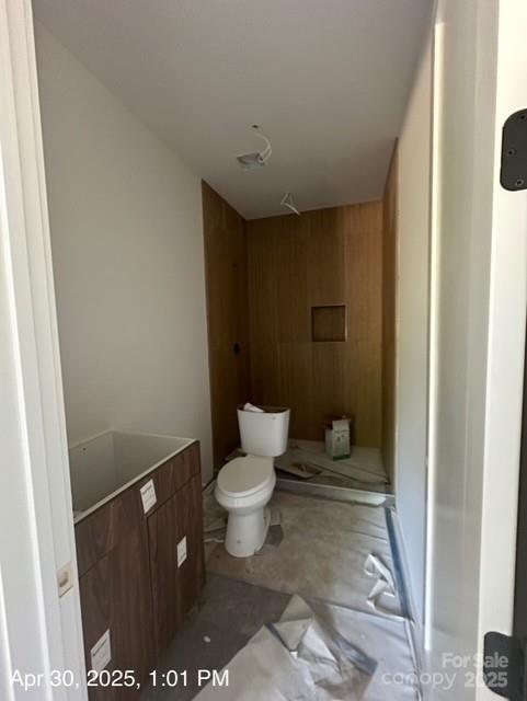 312 Wesley Heights Way Unit A, Charlotte, NC 28208 - bathroom featuring toilet and wood walls