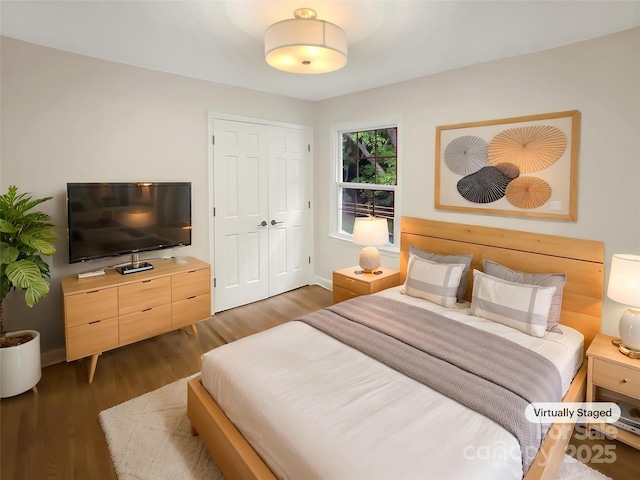 1212 Beechdale Dr, Charlotte, NC 28212 - bedroom with wood finished floors, baseboards, and a closet