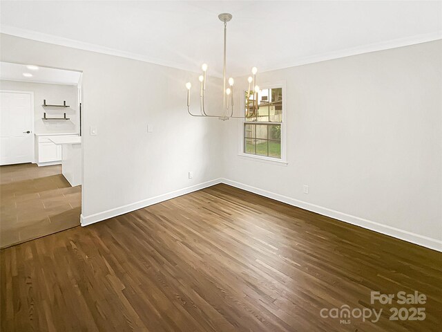 1212 Beechdale Dr, Charlotte, NC 28212 - unfurnished dining area featuring ornamental molding, baseboards, dark wood-style flooring, and a chandelier
