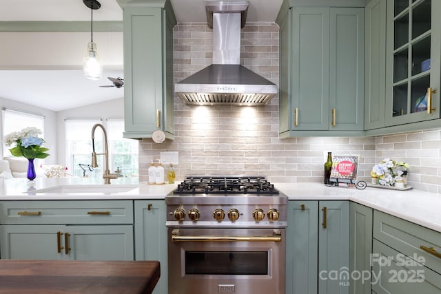 211 Southfork Dr, Belmont, NC 28012 - kitchen featuring high end range, wall chimney exhaust hood, a sink, green cabinetry, and backsplash