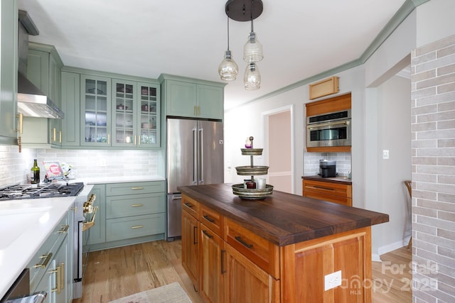 211 Southfork Dr, Belmont, NC 28012 - kitchen featuring high end appliances, light wood finished floors, tasteful backsplash, glass insert cabinets, and butcher block countertops
