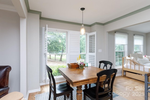 211 Southfork Dr, Belmont, NC 28012 - dining area featuring crown molding, light wood finished floors, and baseboards