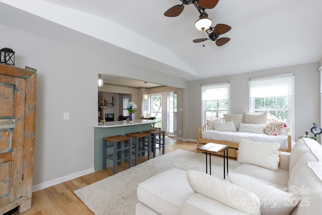 211 Southfork Dr, Belmont, NC 28012 - living room with lofted ceiling, ceiling fan, healthy amount of natural light, light wood-style flooring, and baseboards