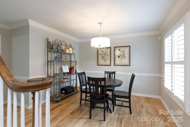 211 Southfork Dr, Belmont, NC 28012 - dining room with light wood-style floors, baseboards, and crown molding