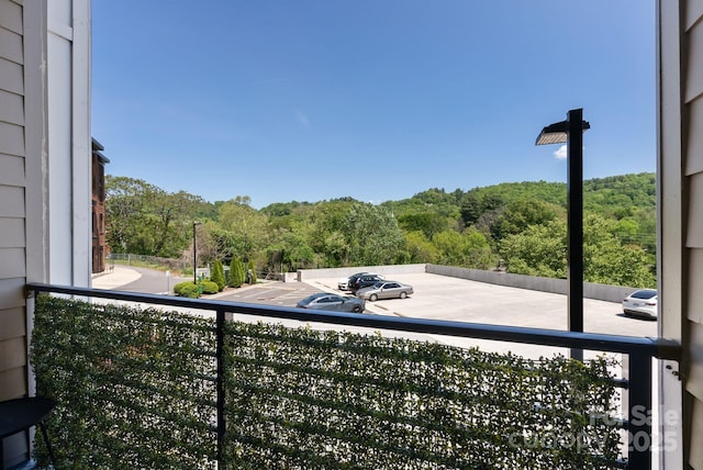 55 S Market St Unit 311, Asheville, NC 28801 - balcony featuring a wooded view