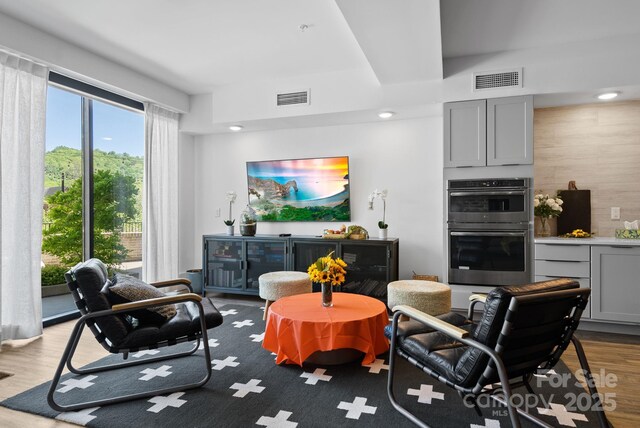 55 S Market St Unit 311, Asheville, NC 28801 - living room featuring wood finished floors and recessed lighting