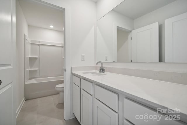 full bathroom featuring vanity, tile patterned floors, toilet, baseboards, and shower / bath combination