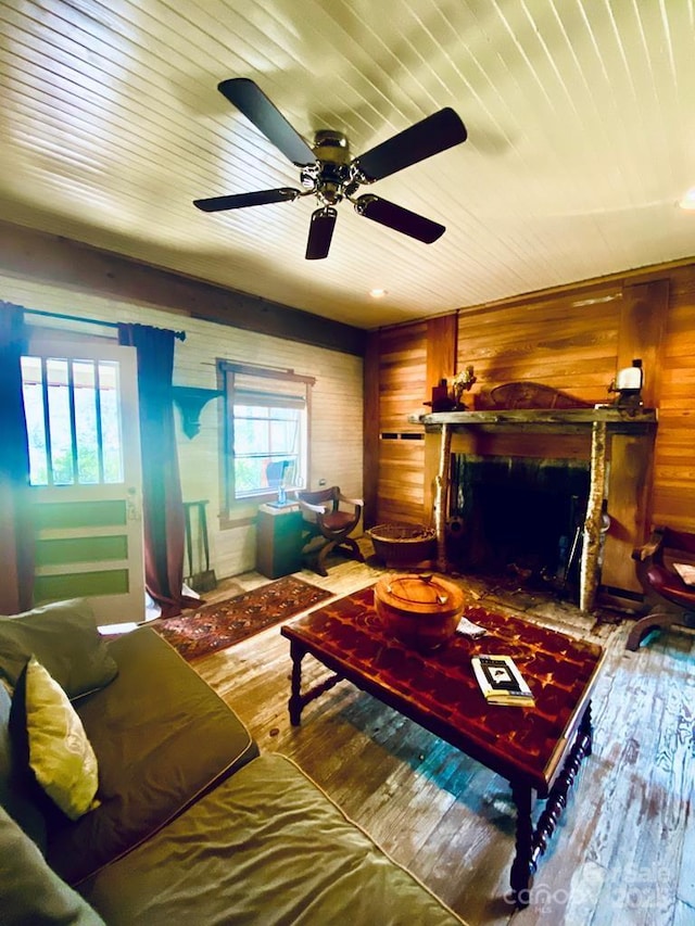 5933 N Norton Rd, Cullowhee, NC 28723 - living area with wooden walls, hardwood / wood-style flooring, a fireplace, ceiling fan, and wooden ceiling