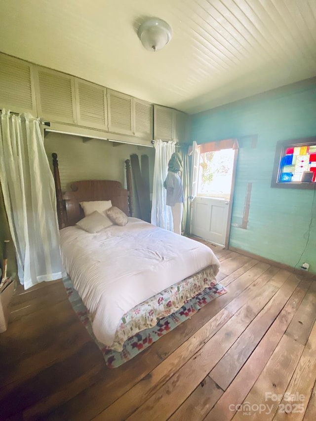 5933 N Norton Rd, Cullowhee, NC 28723 - bedroom featuring hardwood / wood-style flooring and baseboards
