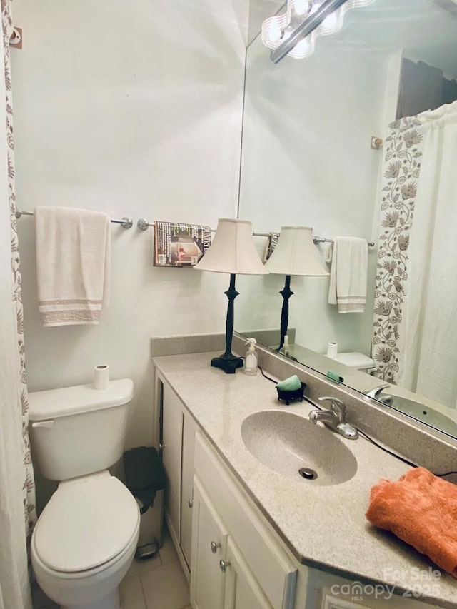 5933 N Norton Rd, Cullowhee, NC 28723 - full bath with toilet, vanity, and tile patterned flooring