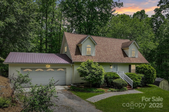 84 Varnadore Dr, Arden, NC 28704 - cape cod-style house with driveway, an attached garage, and a lawn