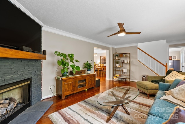 84 Varnadore Dr, Arden, NC 28704 - living area featuring stairway, ornamental molding, ceiling fan, wood finished floors, and a fireplace