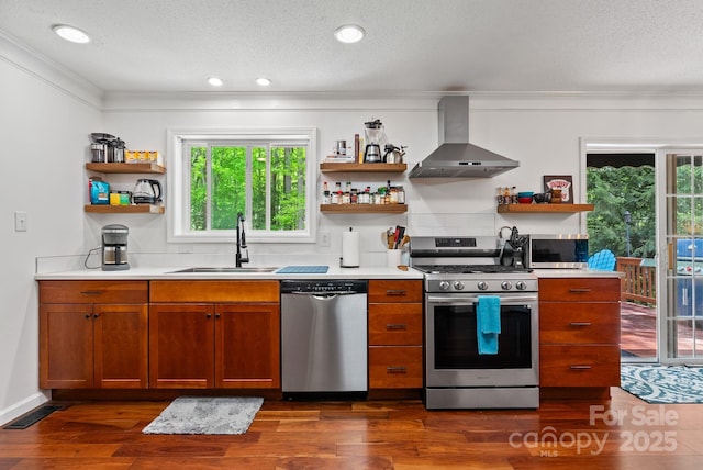 84 Varnadore Dr, Arden, NC 28704 - kitchen with stainless steel appliances, open shelves, wall chimney range hood, crown molding, and dark wood finished floors