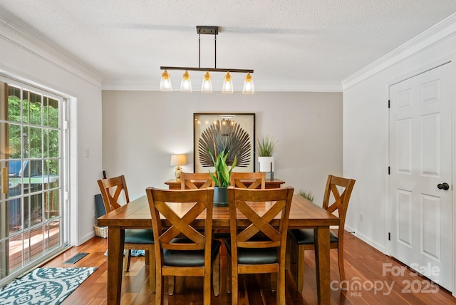 84 Varnadore Dr, Arden, NC 28704 - dining room with light wood-type flooring, crown molding, and a textured ceiling