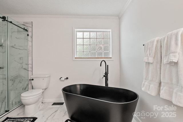 84 Varnadore Dr, Arden, NC 28704 - bathroom featuring crown molding, a freestanding tub, a marble finish shower, marble finish floors, and a textured ceiling