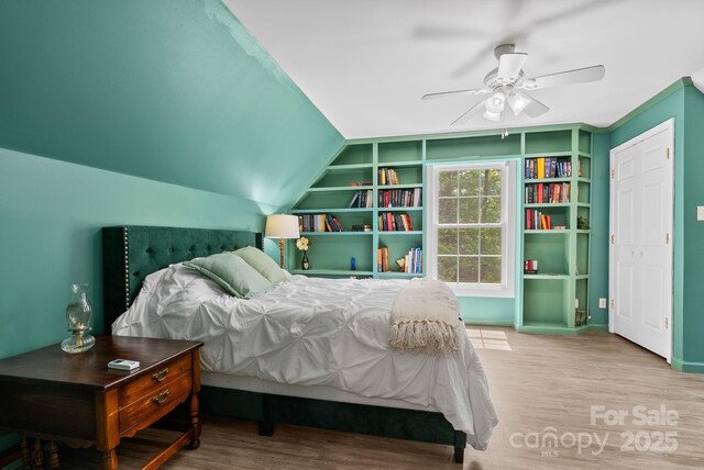 84 Varnadore Dr, Arden, NC 28704 - bedroom featuring wood finished floors, vaulted ceiling, and a ceiling fan