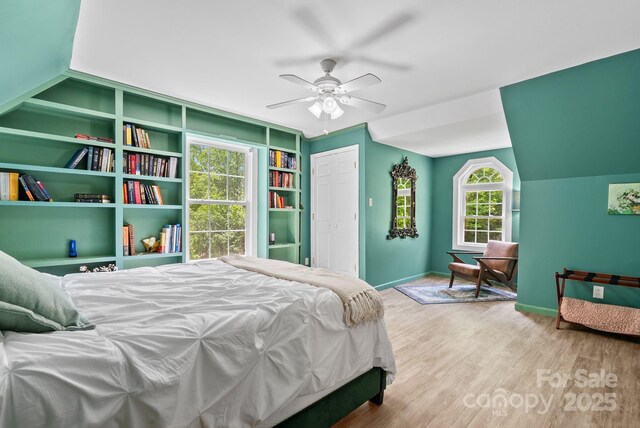 84 Varnadore Dr, Arden, NC 28704 - bedroom with wood finished floors, a closet, vaulted ceiling, and ceiling fan