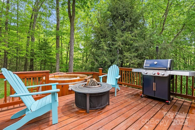 84 Varnadore Dr, Arden, NC 28704 - wooden deck featuring a fire pit, a grill, and a view of trees