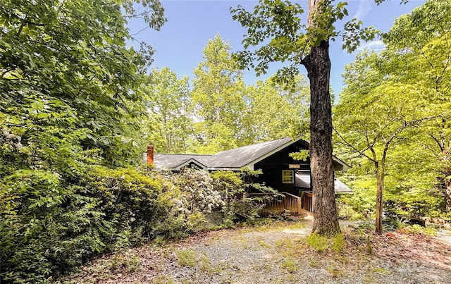 view of home's exterior with a chimney